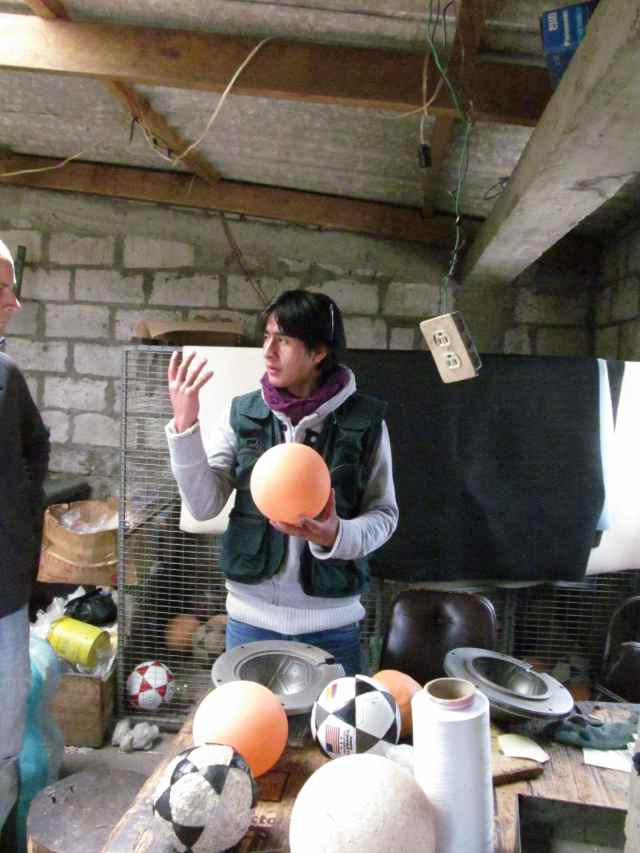 Salinas tour guide explains soccer ball construction.